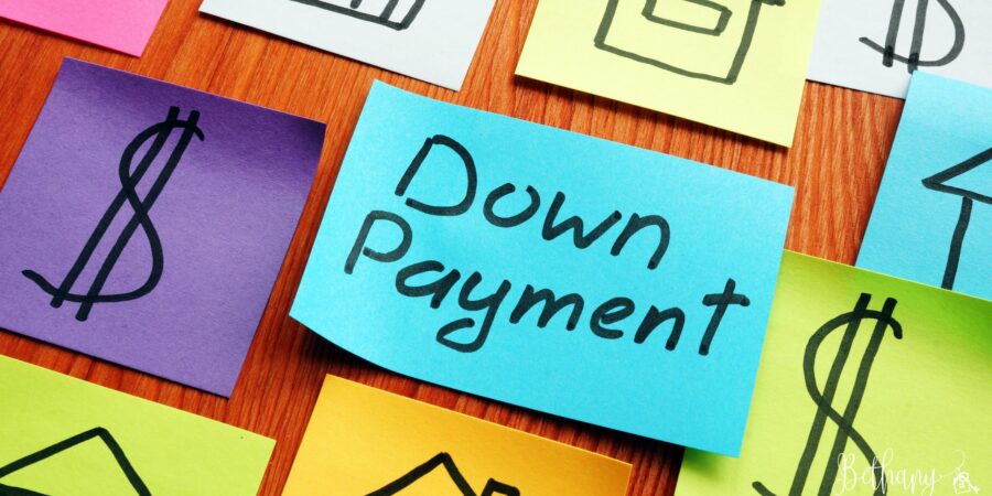 A post-it note on a desk that reads Down Payment.